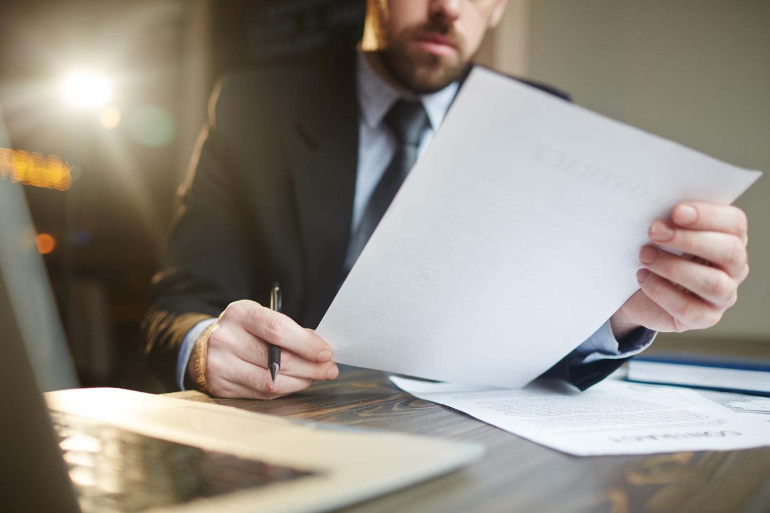 Man working with legislative documentation on scraping